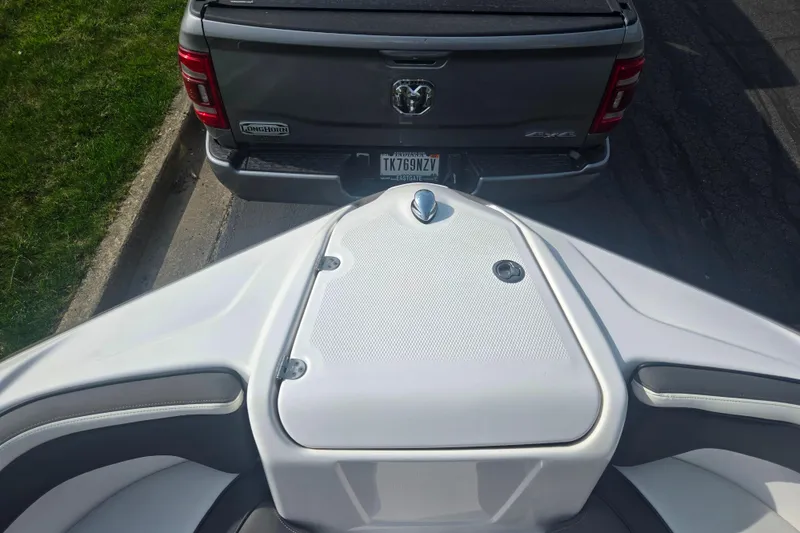 Slide: The Image of 2022 Yamaha AR210 boat on trailer behind a gray pickup truck. - 18