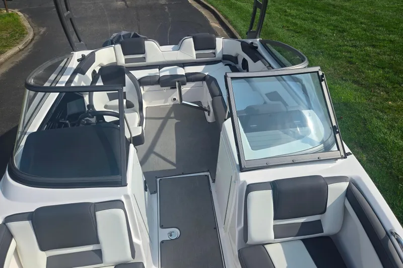 Slide: The Image of 2022 Yamaha Boats AR210 interior with sleek seating and modern design. - 20