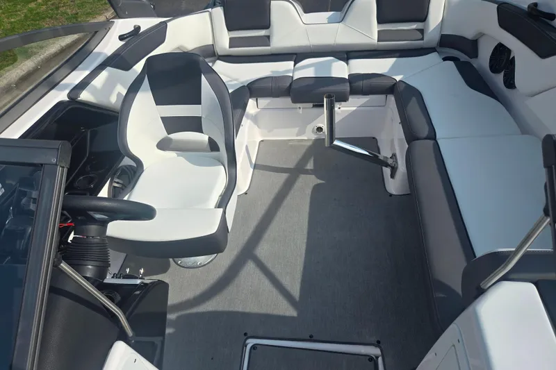 Slide: The Image of 2022 Yamaha Boats AR210 interior with sleek seating and modern design. - 21