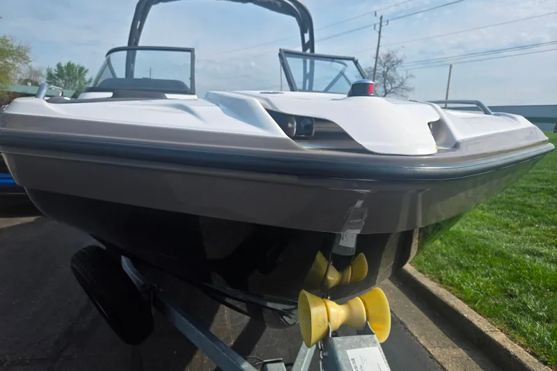 Slide: The Image of 2022 Yamaha Boats AR210 on trailer, sleek design, parked outdoors. - 6