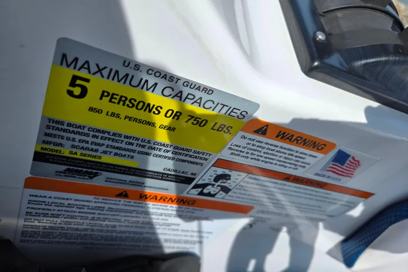 Slide: The Image of 2021 Scarab 165 ID boat capacity label, showing maximum capacity of 5 persons or 750 lbs. - 13