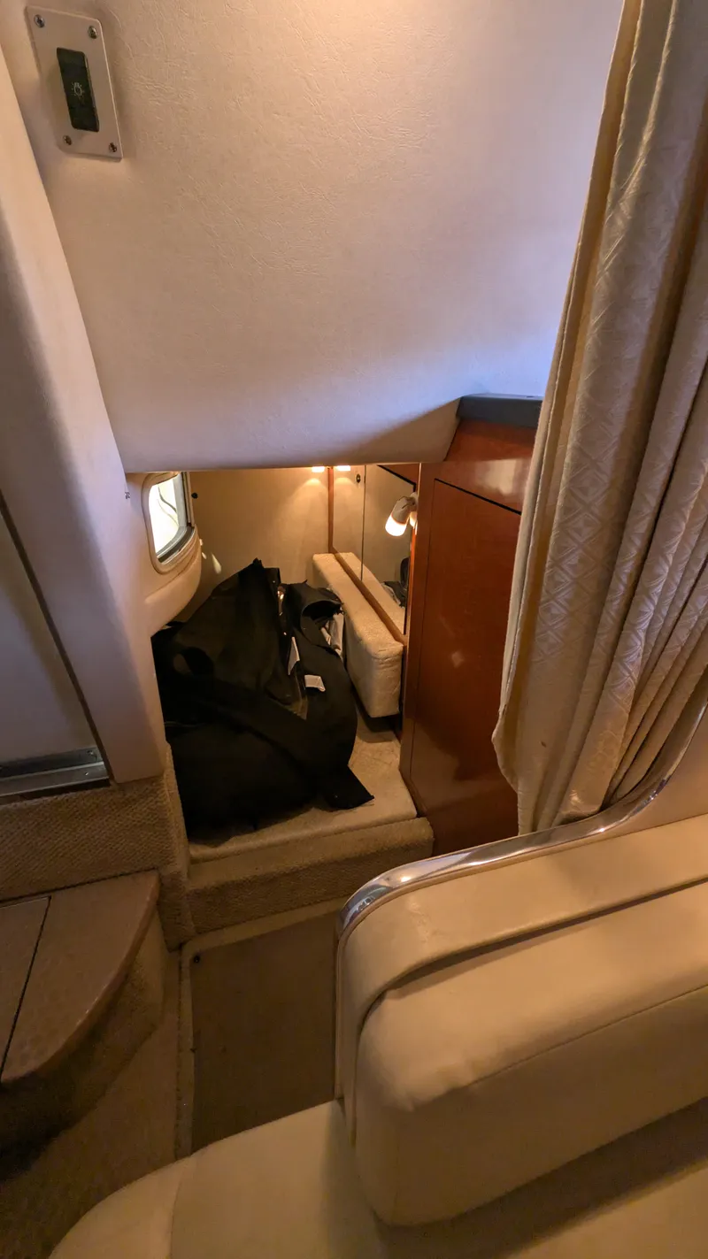 Slide: The Image of Interior cabin of 2004 Sea Ray 280 Sundancer with seating and storage. - 24