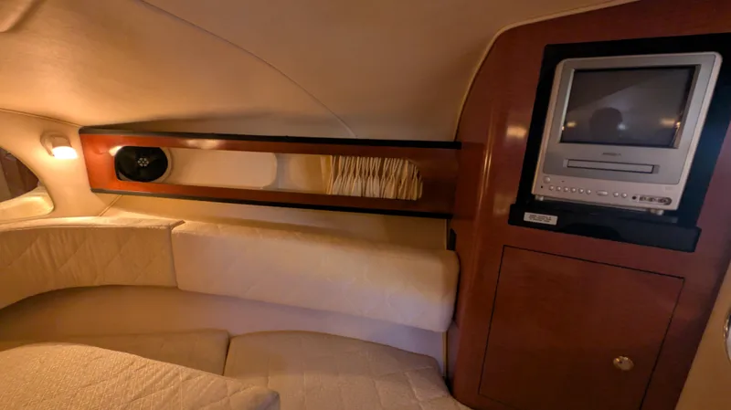 Slide: The Image of Interior of 2004 Sea Ray 280 Sundancer with TV and cozy seating area. - 26
