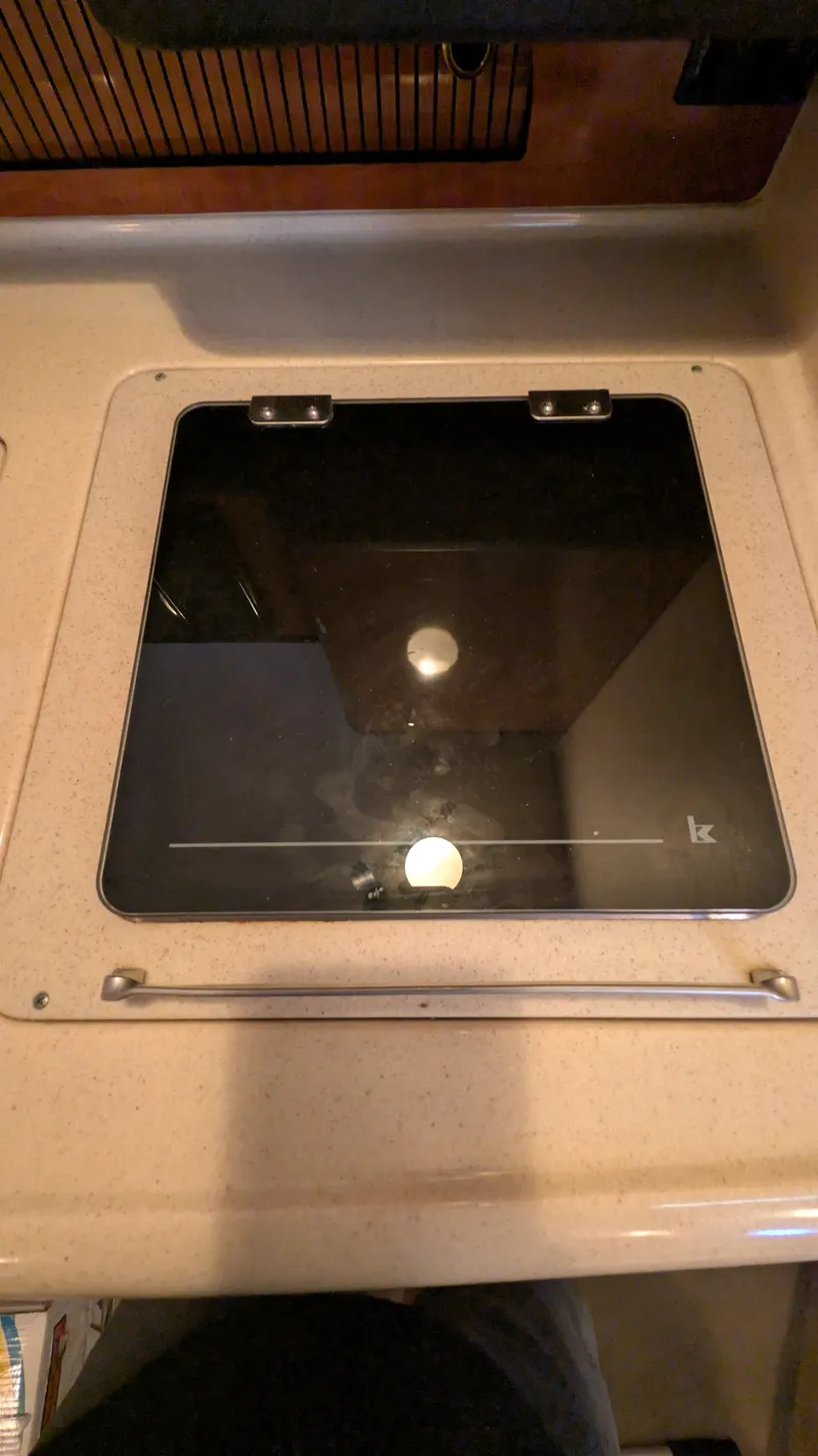 Slide: The Image of Stove top on 2004 Sea Ray 280 Sundancer boat kitchen counter. - 27