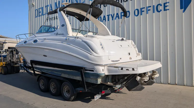 Slide: The Image of 2004 Sea Ray 280 Sundancer boat on trailer at Delta Marina boatyard. - 3