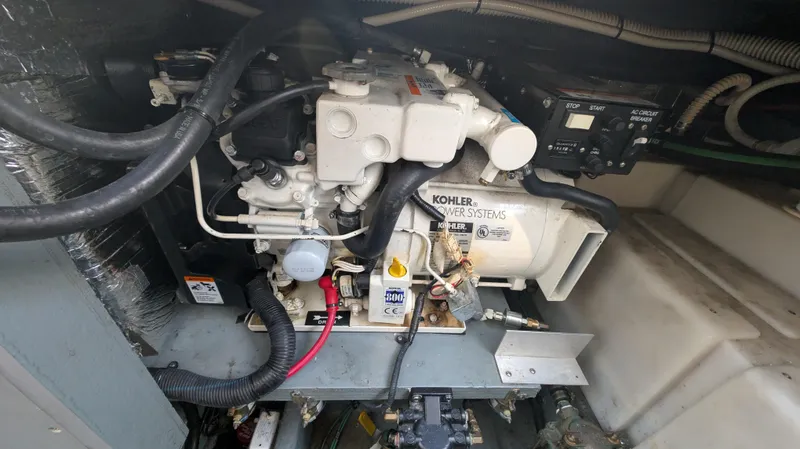 Slide: The Image of Engine compartment of a 2004 Sea Ray 280 Sundancer with Kohler power system. - 31