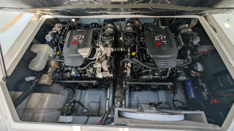 Slide: The Image of Engine compartment of a 2004 Sea Ray 280 Sundancer with dual 5.0 MPI engines. - 32