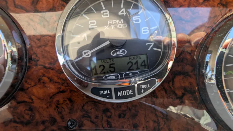 Slide: The Image of Close-up of 2004 Sea Ray 280 Sundancer dashboard showing RPM gauge and digital display. - 37