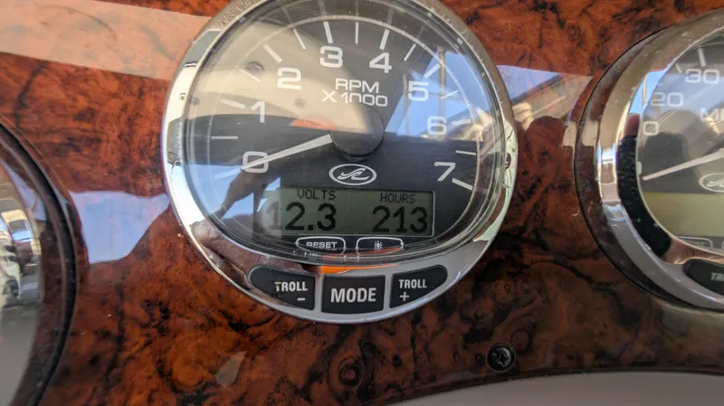 Slide: The Image of Dashboard of 2004 Sea Ray 280 Sundancer showing RPM and voltage. - 38
