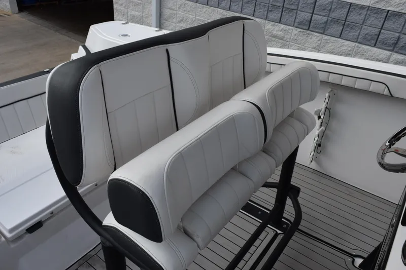 Slide: The Image of 2021 Yamaha Boats 255 FSH Sport E interior seating with sleek, modern design. - 10