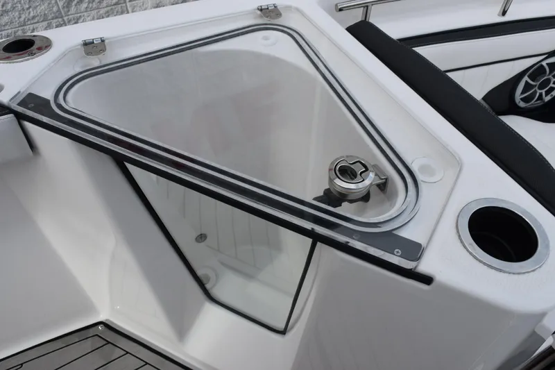 Slide: The Image of Yamaha Boats 2021 255 FSH Sport E, featuring a sleek storage compartment. - 16