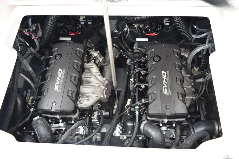 Slide: The Image of 2021 Yamaha Boats 255 FSH Sport E engine compartment with twin SVHO engines. - 20