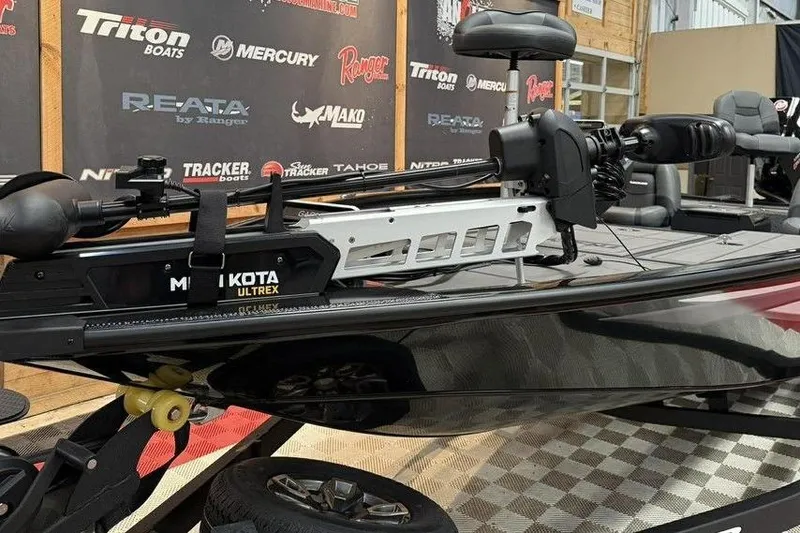 Slide: The Image of 2026 Tracker Savage 215 boat with Minn Kota Ultrex motor on display. - 5