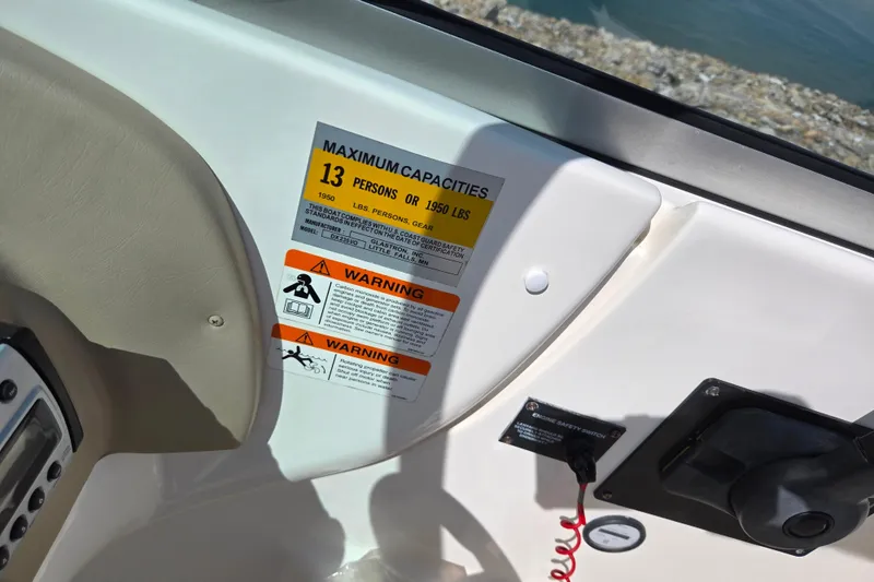 Slide: The Image of 2006 Glastron DX 235 boat capacity label, maximum 13 persons or 1950 lbs. - 15