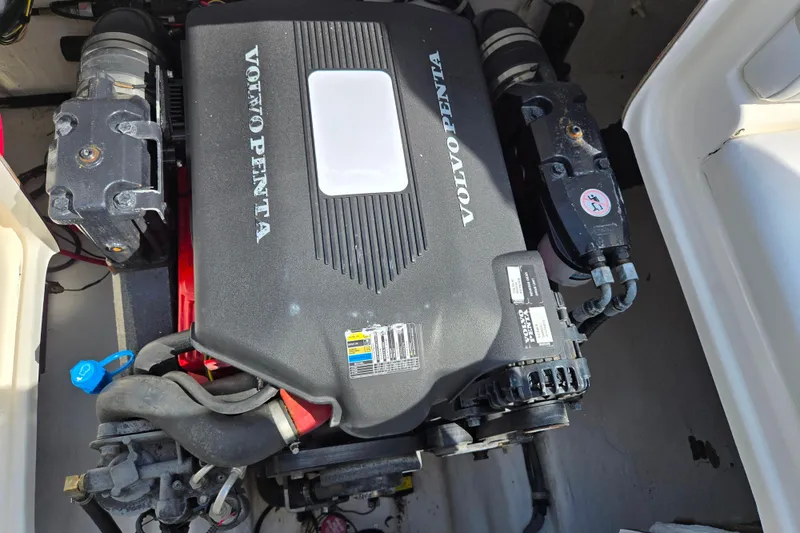 Slide: The Image of Volvo Penta engine in a 2006 Glastron DX 235 boat, detailed view. - 25