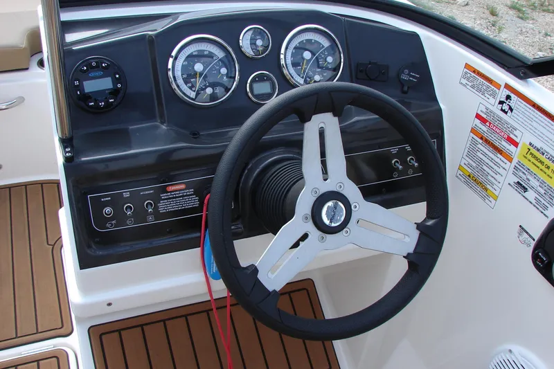 Slide: The Image of Dashboard of 2021 Bayliner VR4 Bowrider I/O with steering wheel and gauges. - 11
