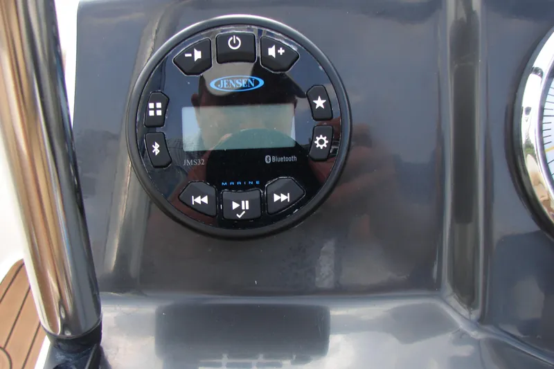 Slide: The Image of Control panel of a 2021 Bayliner VR4 Bowrider I/O with Jensen marine audio system. - 12