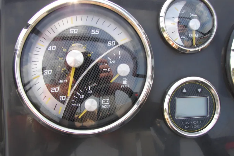 Slide: The Image of Dashboard gauges of a 2021 Bayliner VR4 Bowrider I/O boat. - 14