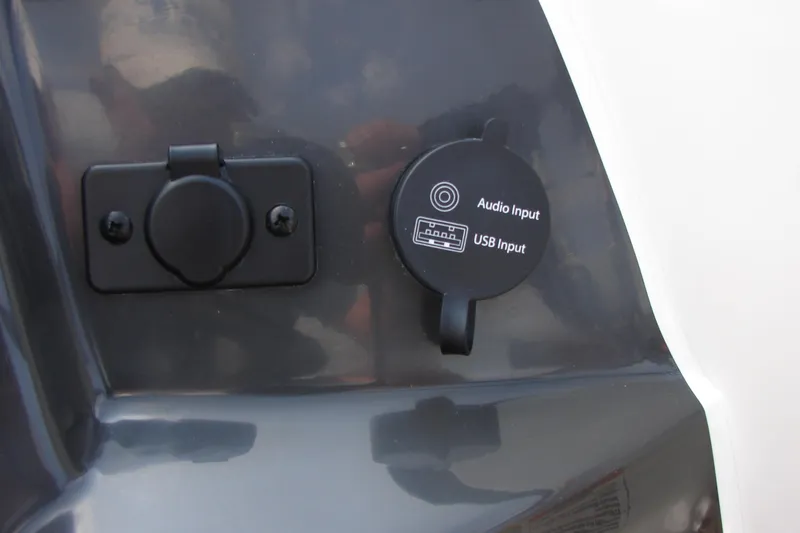 Slide: The Image of 2021 Bayliner VR4 Bowrider I/O audio and USB input ports on dashboard. - 15