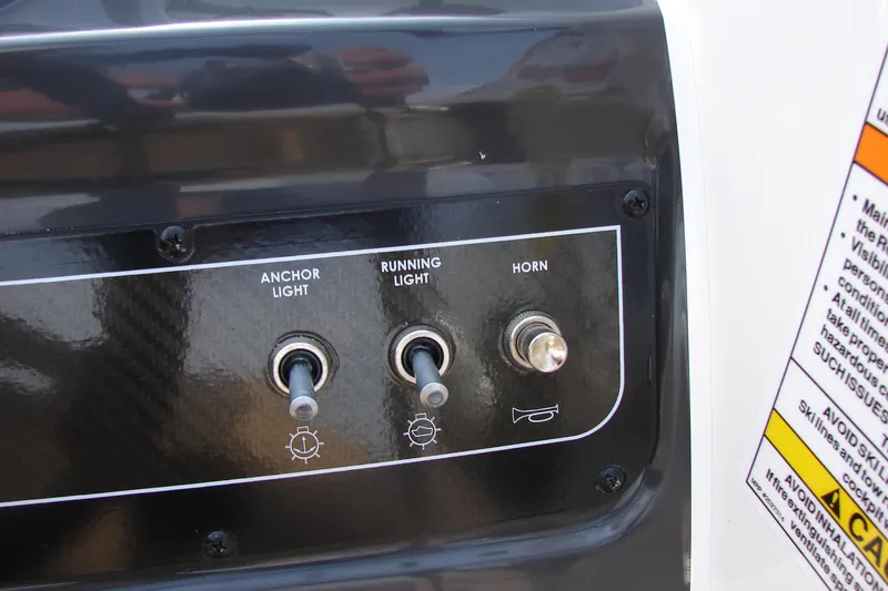 Slide: The Image of Control panel of 2021 Bayliner VR4 Bowrider I/O with switches for anchor light, running light, and horn. - 16