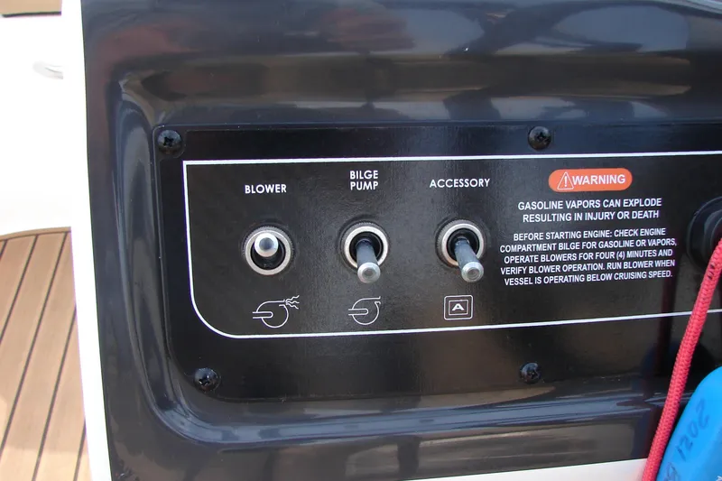 Slide: The Image of Control panel of a 2021 Bayliner VR4 Bowrider I/O with blower, bilge pump, and accessory switches. - 17