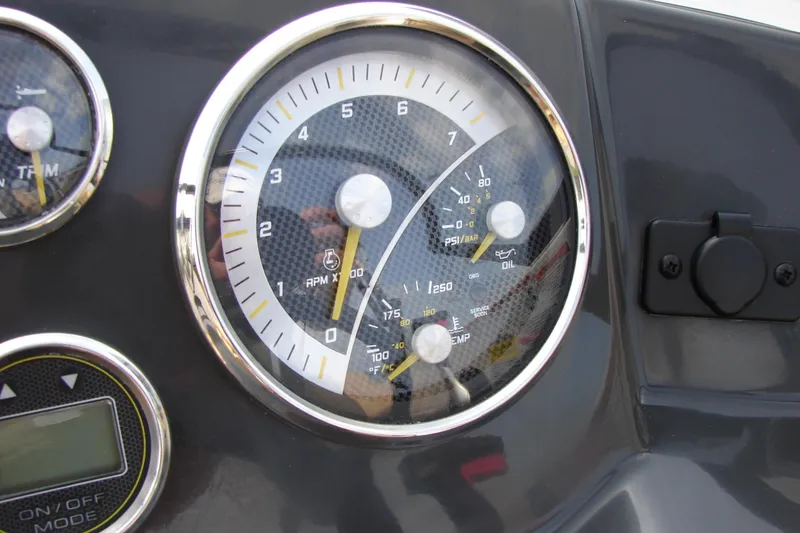 Slide: The Image of Dashboard gauges of a 2021 Bayliner VR4 Bowrider I/O boat. - 18