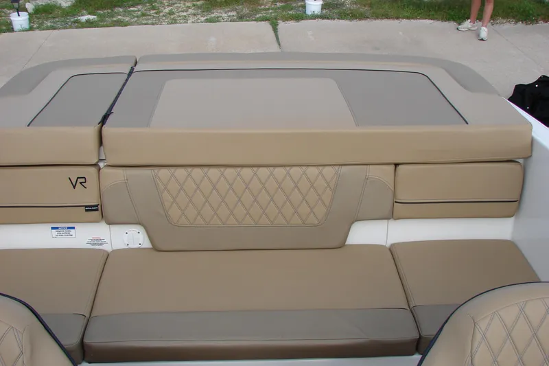 Slide: The Image of 2021 Bayliner VR4 Bowrider I/O interior with beige cushioned seating and diamond stitching. - 20