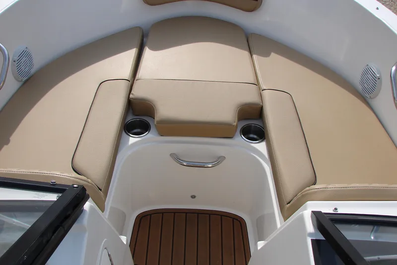 Slide: The Image of 2021 Bayliner VR4 Bowrider I/O interior with tan seating and cup holders. - 23