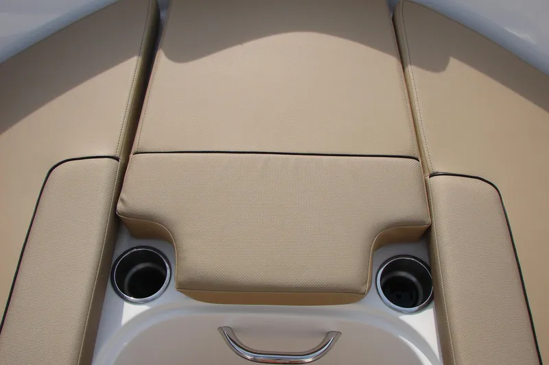 Slide: The Image of 2021 Bayliner VR4 Bowrider I/O boat interior with beige cushioned seating and cup holders. - 26
