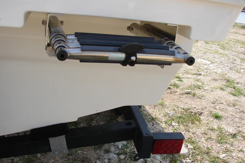 Slide: The Image of 2021 Bayliner VR4 Bowrider I/O swim ladder and trailer detail. - 8