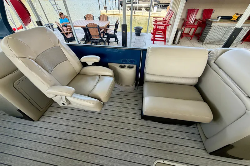 Slide: The Image of Luxurious seating on a 2017 South Bay 725 RS pontoon boat with lake view. - 14