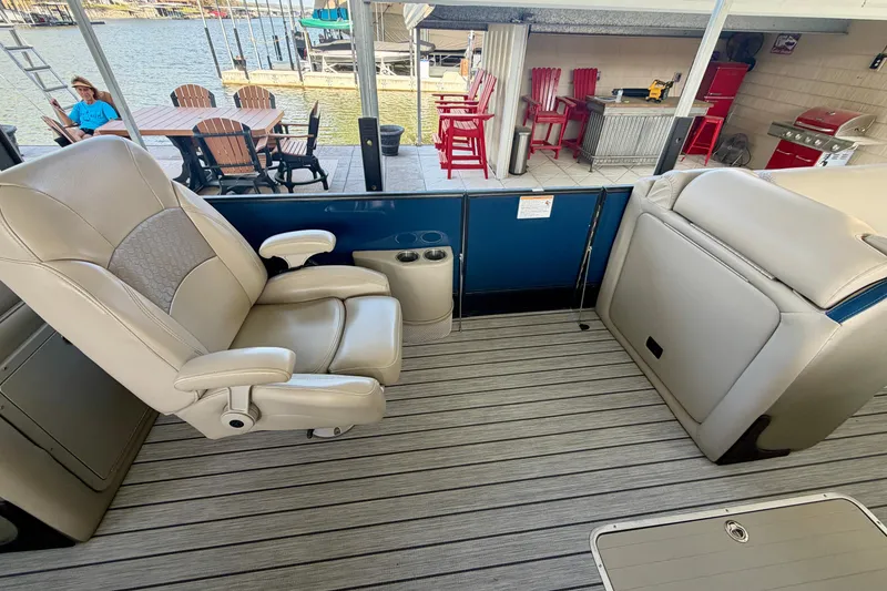 Slide: The Image of 2017 South Bay 725 RS boat interior with beige seating and lake view. - 15