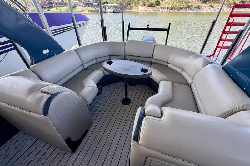 Slide: The Image of Luxurious 2017 South Bay 725 RS pontoon boat interior with plush seating and table. - 24