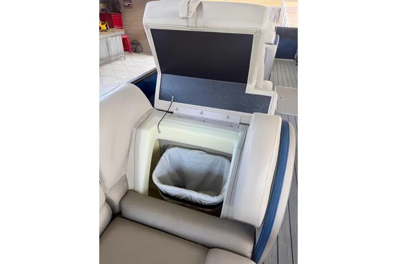 Slide: The Image of 2017 South Bay 725 RS boat seat with built-in storage compartment and trash bin. - 26