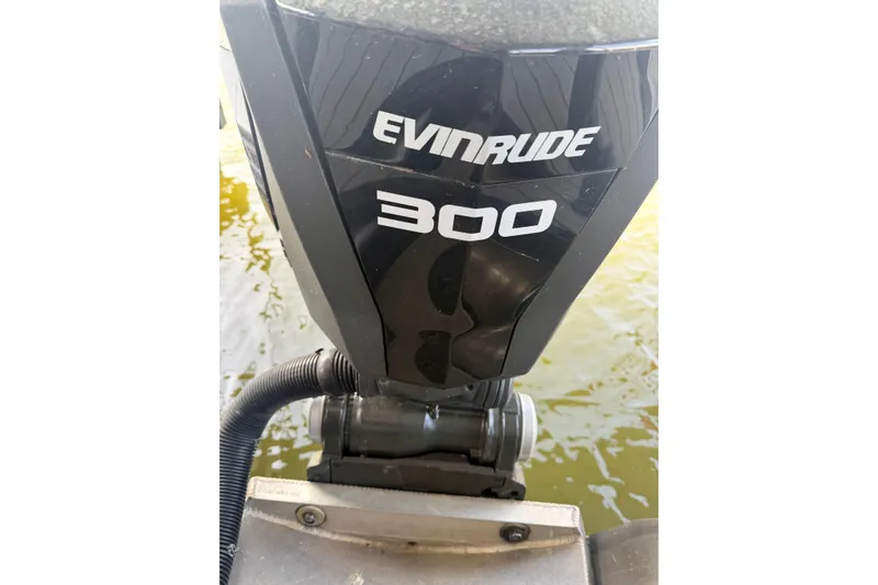 Slide: The Image of Evinrude 300 outboard motor on a 2017 South Bay 725 RS boat. - 28