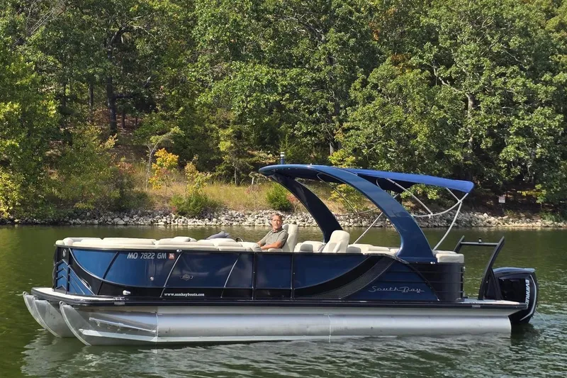 Slide: The Image of 2017 South Bay 725 RS pontoon boat on a serene lake. - 3