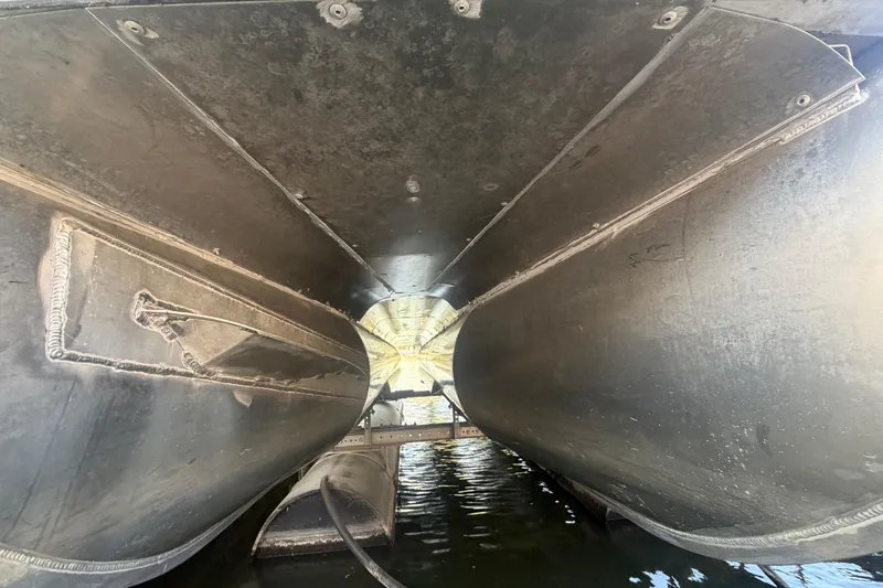 Slide: The Image of Underneath view of a 2017 South Bay 725 RS pontoon boat on water. - 32