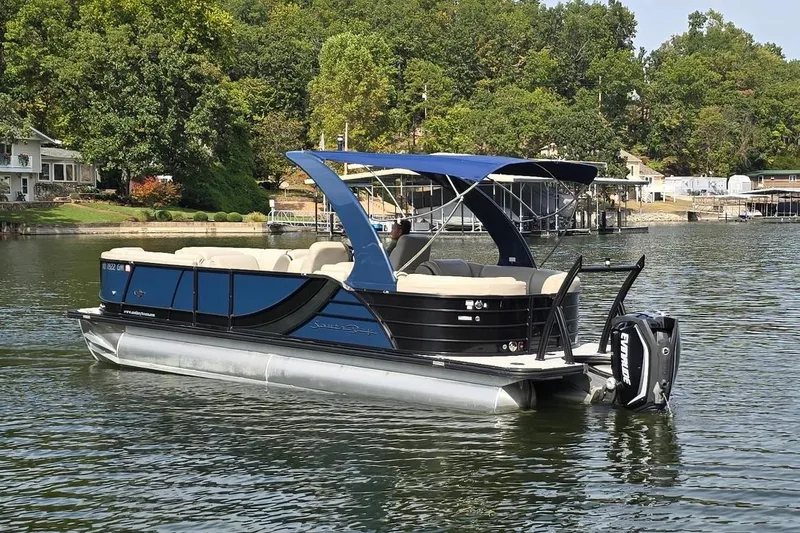 Slide: The Image of 2017 South Bay 725 RS pontoon boat on a serene lake. - 6