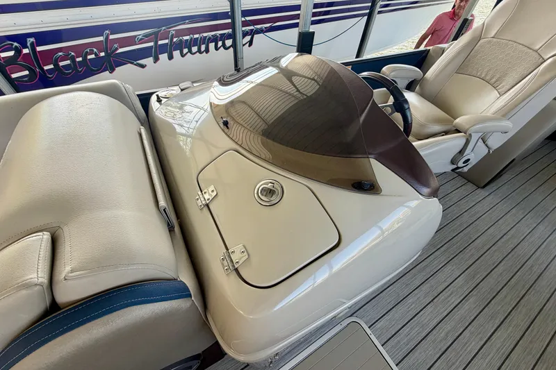 Slide: The Image of 2017 South Bay 725 RS boat interior with steering console and seating. - 9