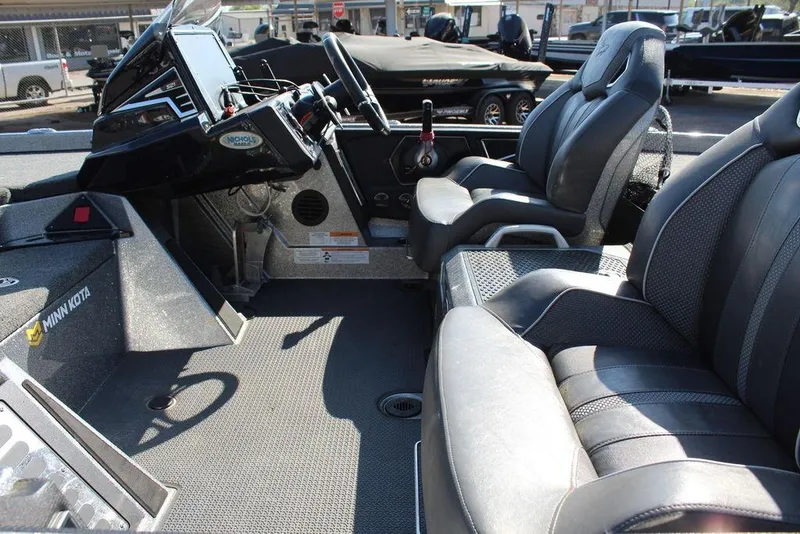 Slide: The Image of 2023 Ranger Z521R boat interior with steering console and seating. - 15