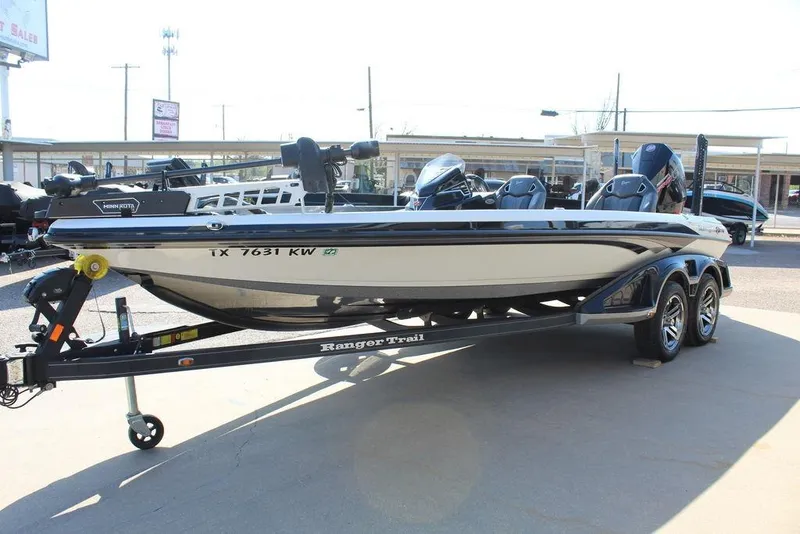 Slide: The Image of 2023 Ranger Z521R boat on trailer in outdoor dealership setting. - 7