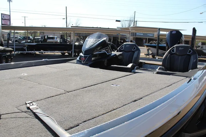 Slide: The Image of 2023 Ranger Z521R boat with spacious deck and sleek seating design. - 8