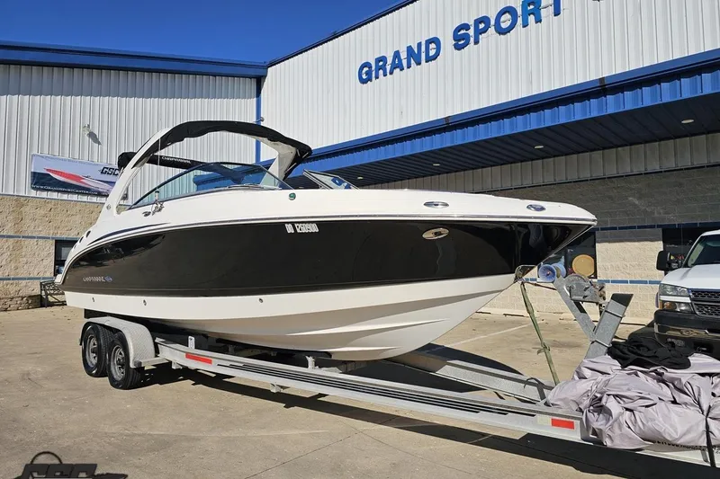 Slide: The Image of 2010 Chaparral 276 SSX boat on trailer outside Grand Sport building. - 10