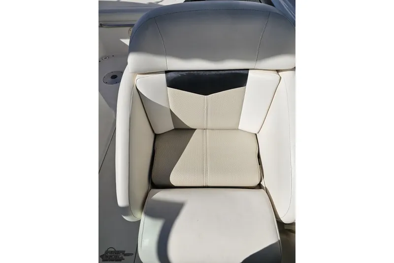 Slide: The Image of Chaparral 276 SSX 2010 boat seat with beige and white upholstery. - 101