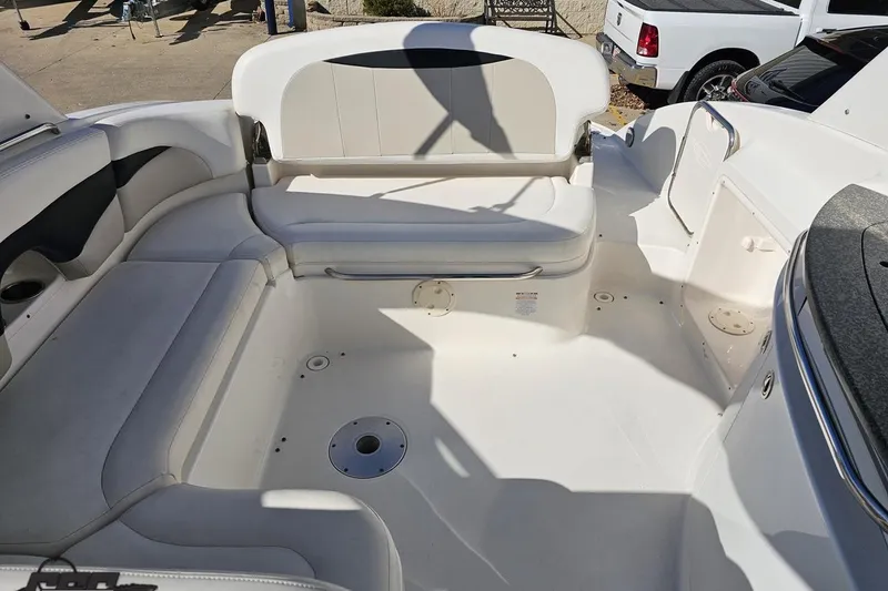 Slide: The Image of 2010 Chaparral 276 SSX boat interior with spacious seating and sleek design. - 104
