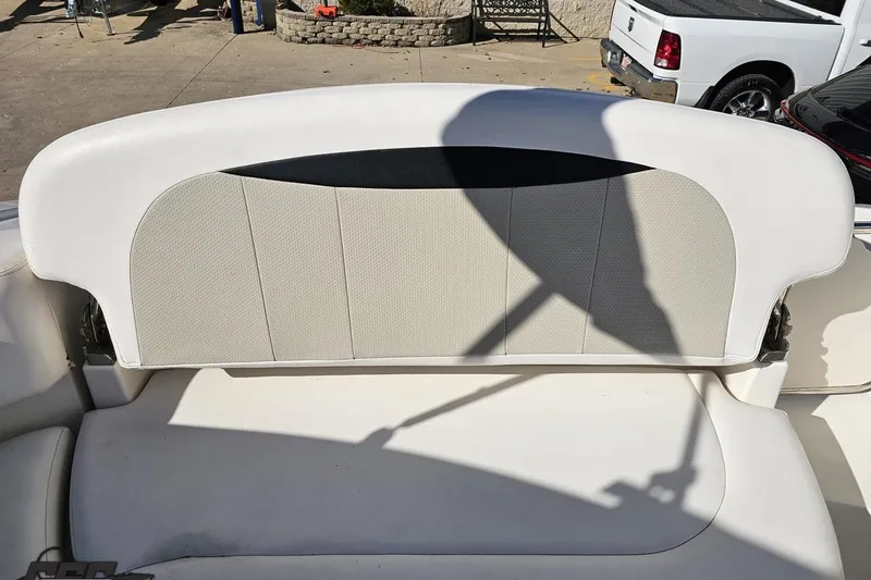 Slide: The Image of 2010 Chaparral 276 SSX boat seat with white and beige upholstery. - 109