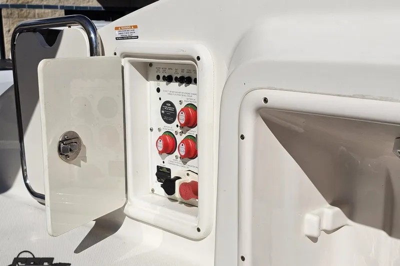 Slide: The Image of Control panel of a 2010 Chaparral 276 SSX boat with open access door. - 110