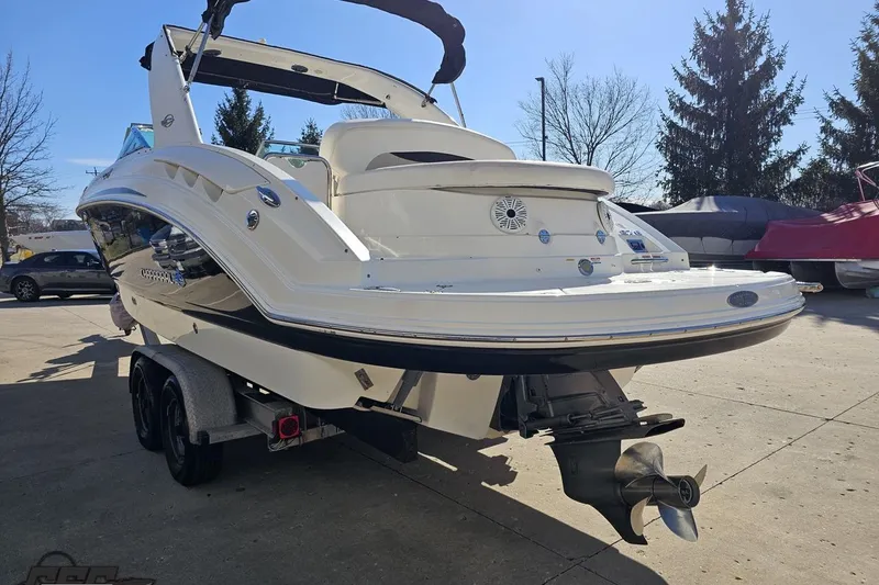 Slide: The Image of 2010 Chaparral 276 SSX boat on trailer, rear view, outdoors. - 23