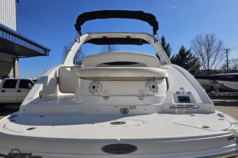Slide: The Image of 2010 Chaparral 276 SSX boat, rear view, white exterior, outdoor setting. - 25