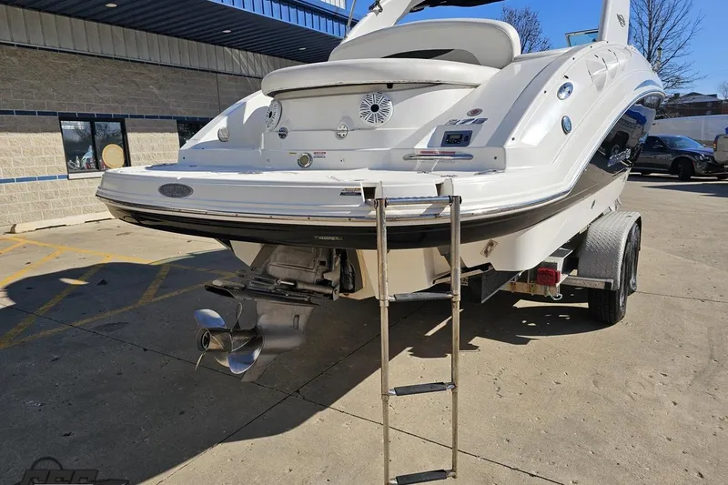 Slide: The Image of 2010 Chaparral 276 SSX boat on trailer, rear view with ladder and propeller. - 28